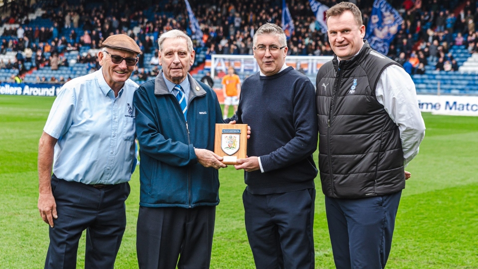 Roy is pictured (second left) with Manchester FA CEO Colin Bridgford, Latics chairman Frank Rothwell and CEO Darren Royle