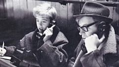 It's 1971 and 14-year-old Alan Buke, later to become well known as a Rugby League referee, is pictured watching an Oldham game with the then Chronicle reporter Roger Halstead. Image courtesy of ORLFC
